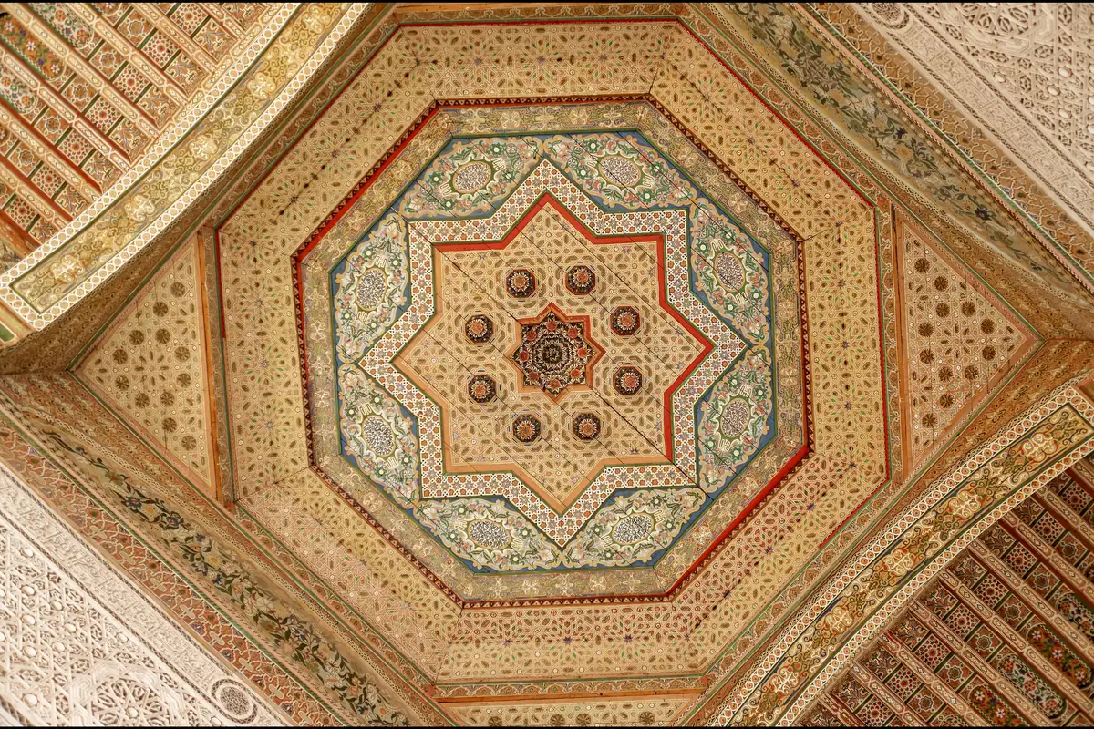 Painted wooden ceiling with a geometric star in the centre, in the Bahia Palace